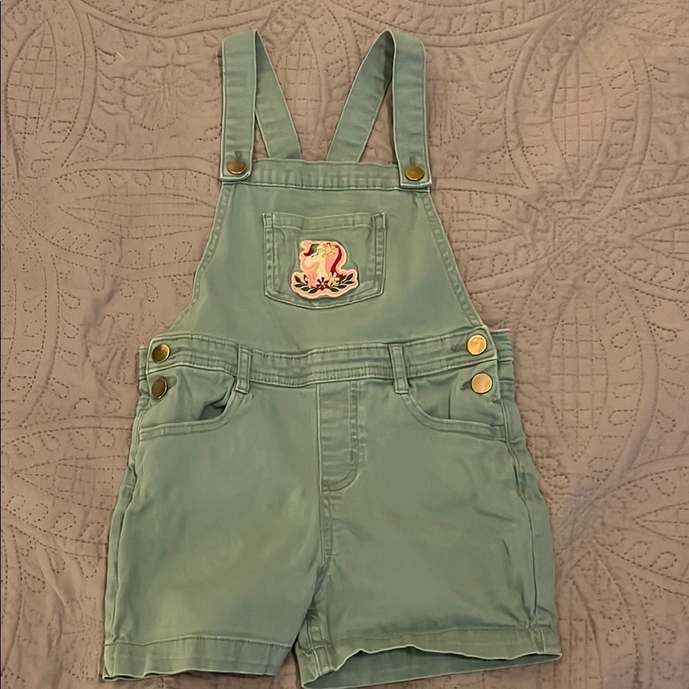 Green Overalls with Adjustable Straps and Decorative Unicorn Patch
